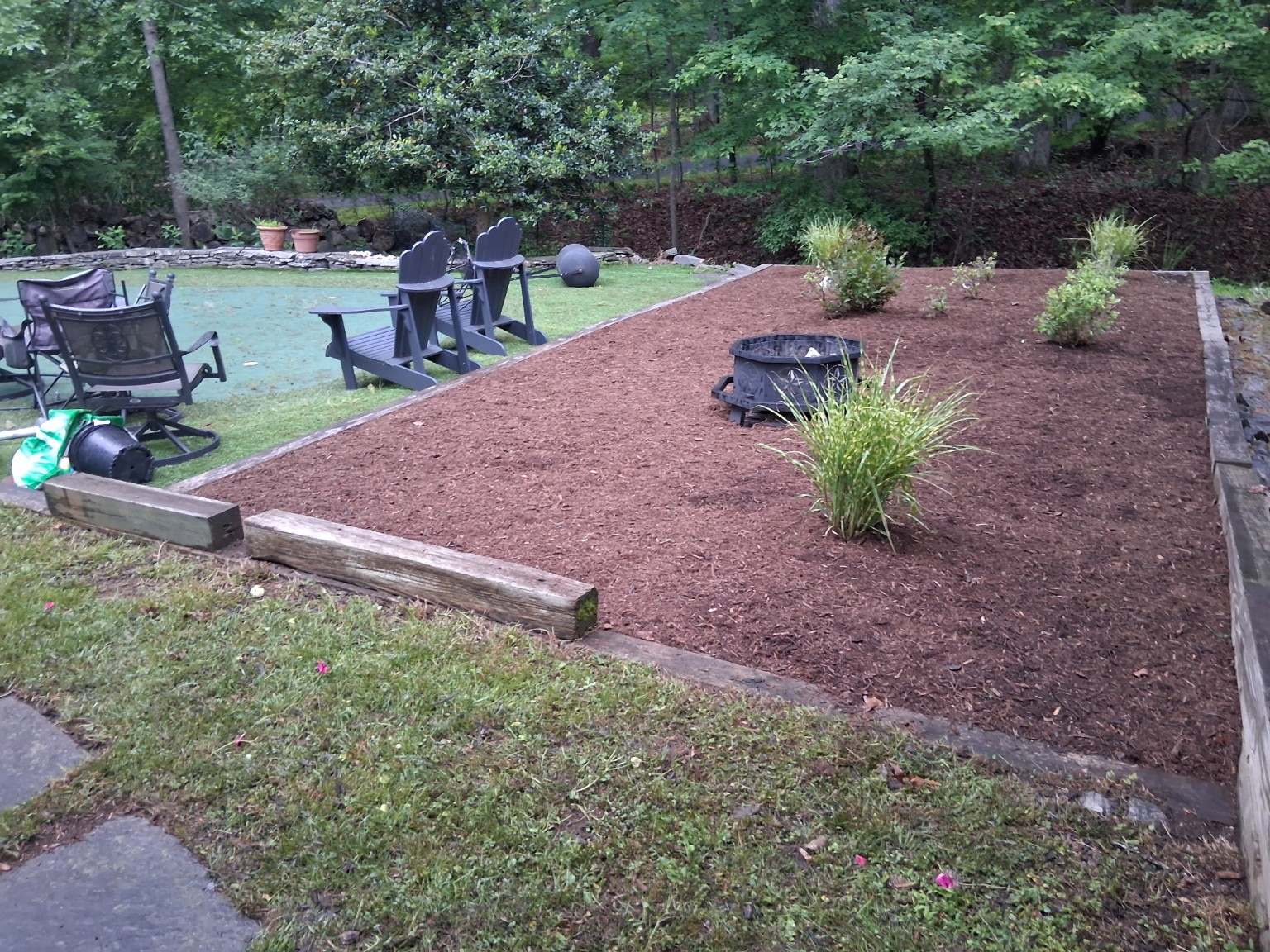 Brown mulch garden bed with grasses
